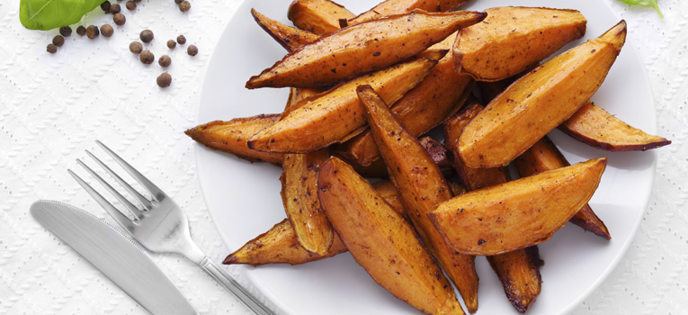 Delicious homemade sweet potato wedges on a plate.
